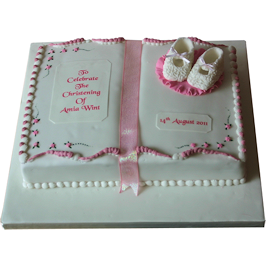 Baby boots and book christening cake